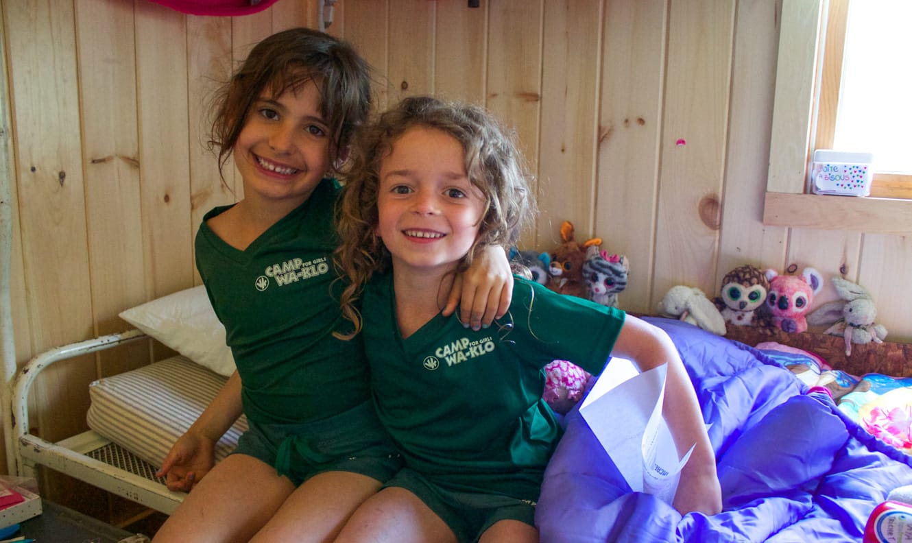 Two young campers in their bunk