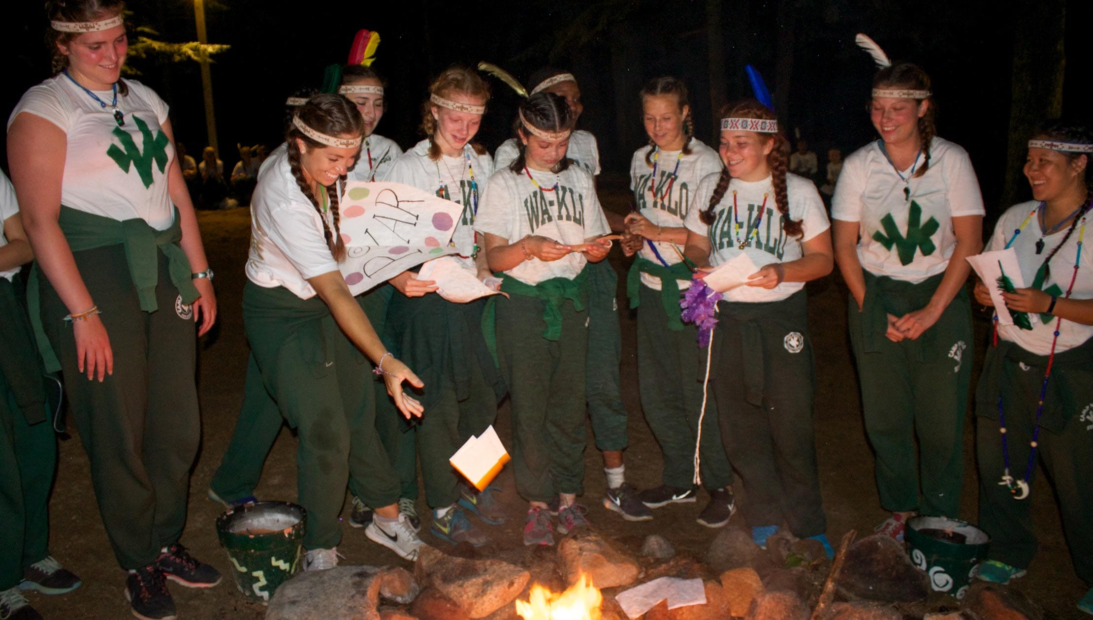 Girls burning notes at the council fire