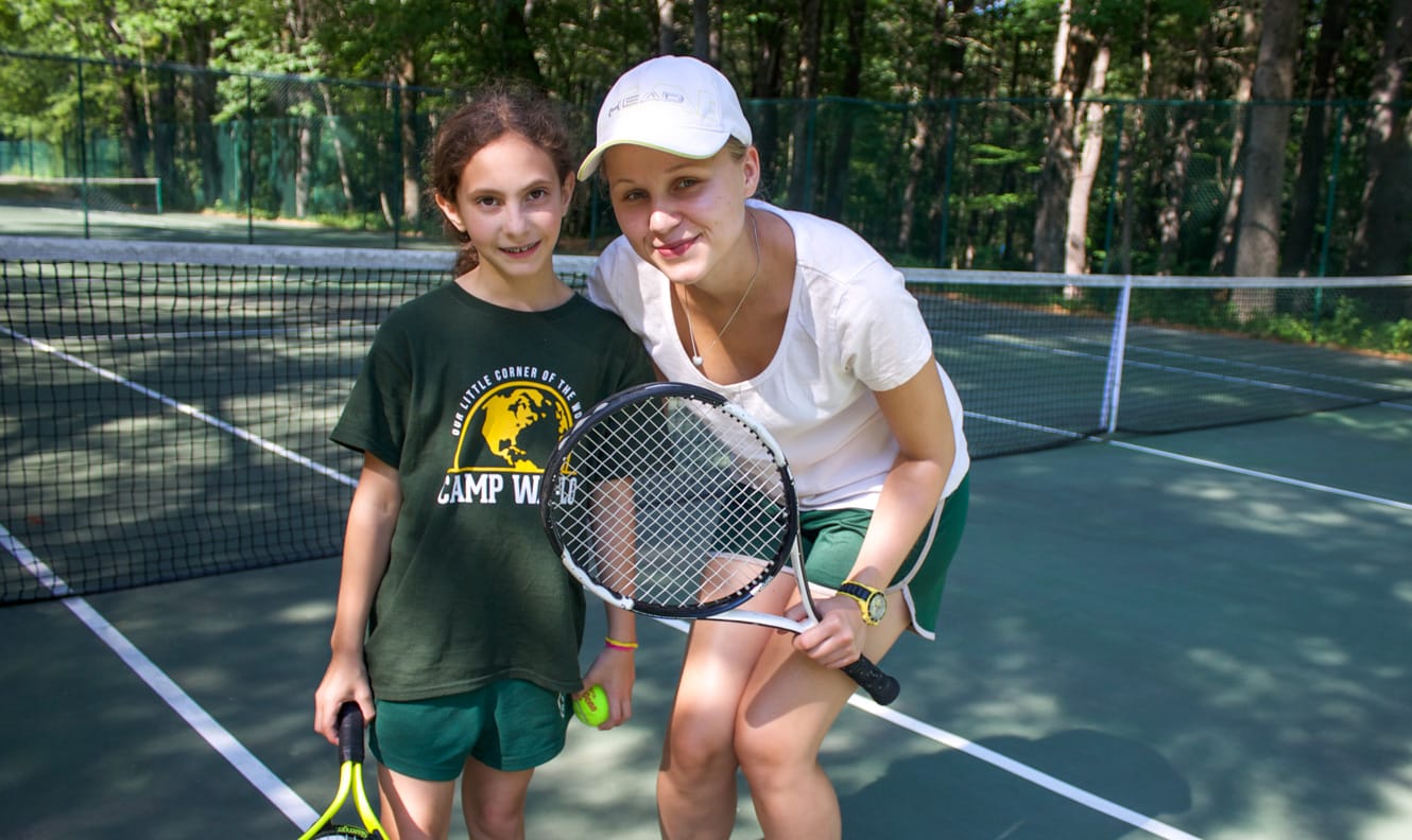 Tennis instructor and camper