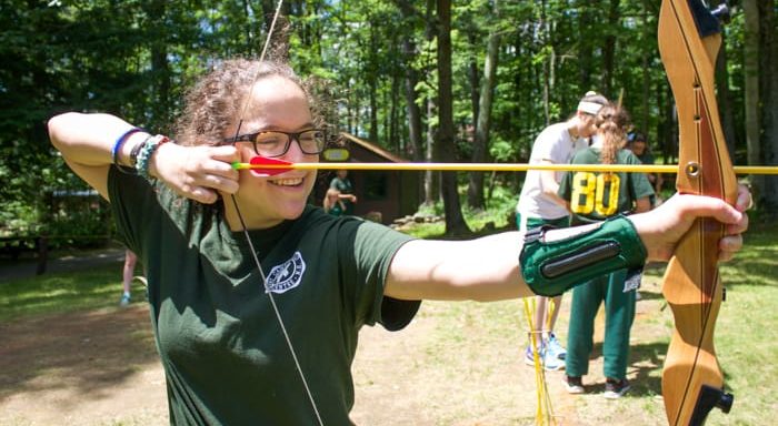 Girl shooting an archery arrow