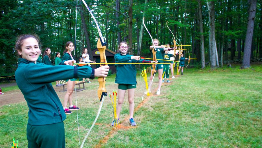 Girls at field archery smiling