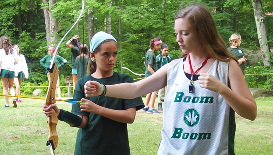 Camper learning archery