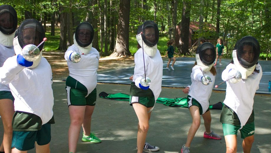 Girls posing during fencing activity