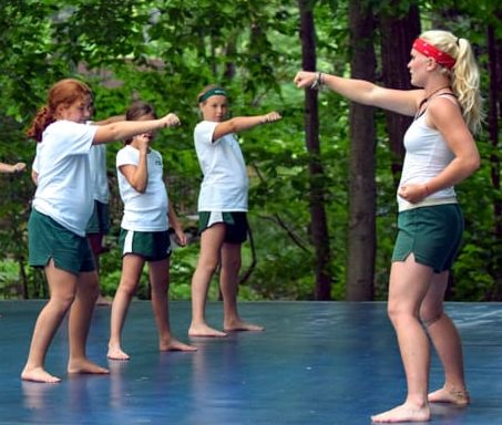 Girls and staff in a workout class