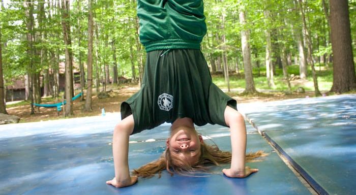 Camper doing a headstand