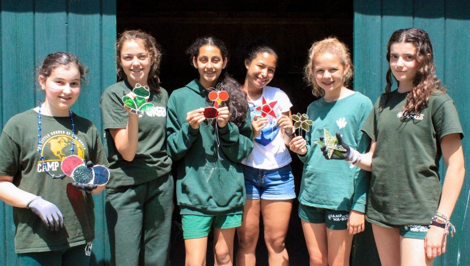 Girls showing off stained glass creations